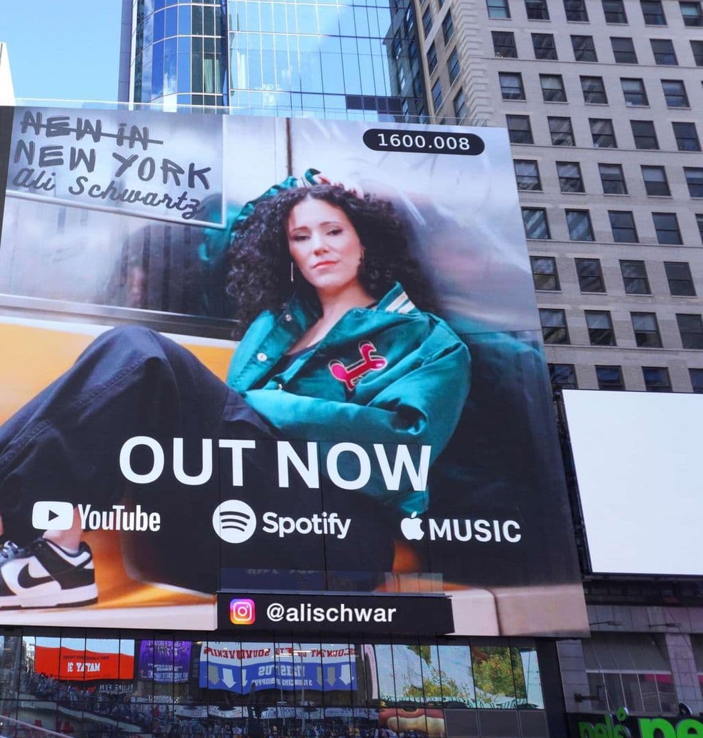 The New in New York billboard over Times Square, tight crop on Ali
